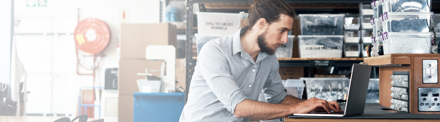 A business owner using his laptop for book keeping