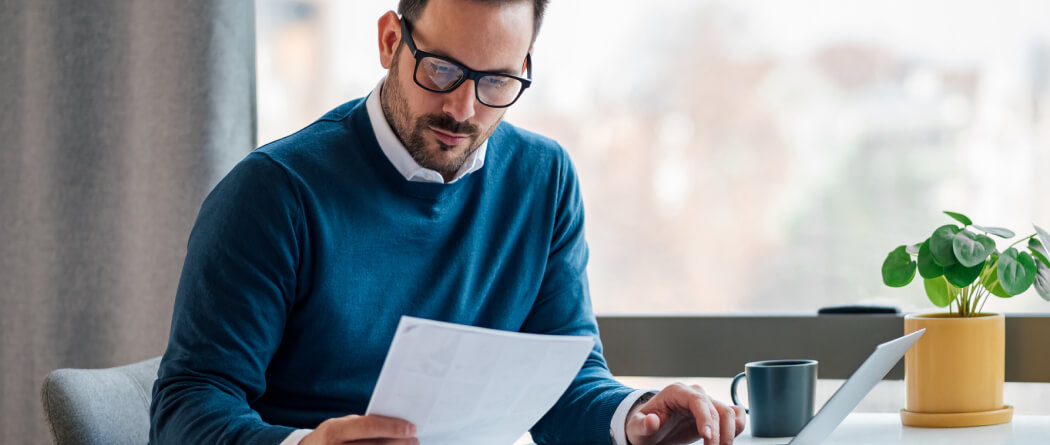 Business man holding paper