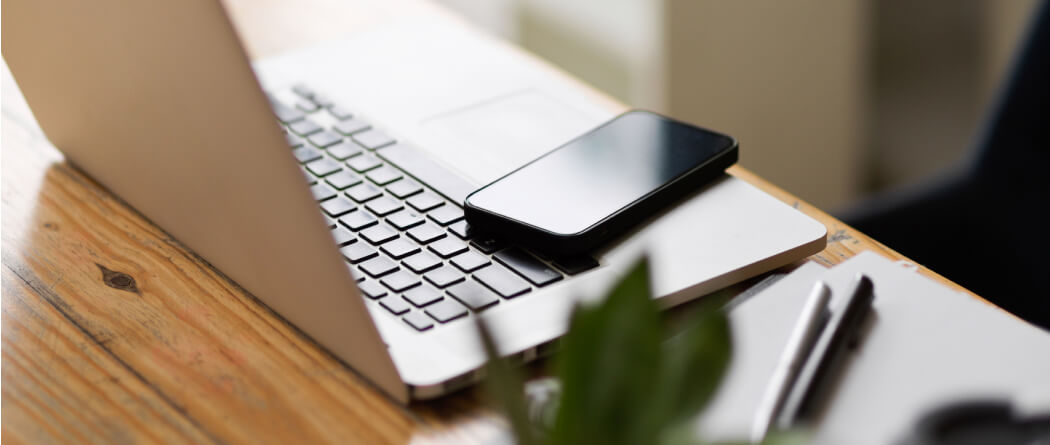 desktop with laptop and mobile phone