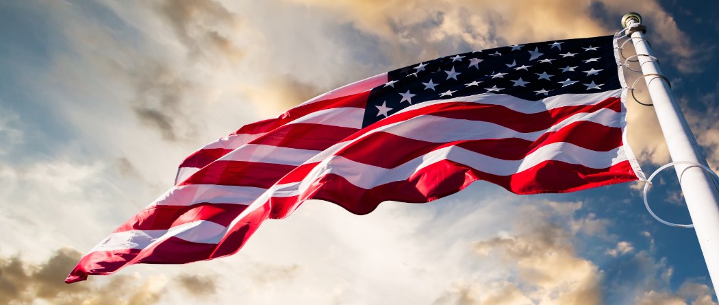 The United States flag waving on a pole