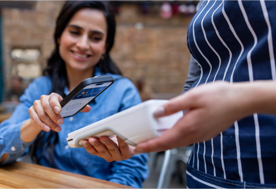 woman using mobile phone for payment